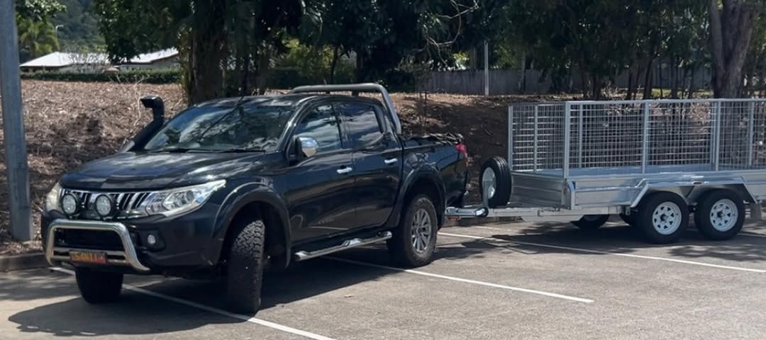 Movin and Groovin Cairns ute and cage trailer for rubbish removal and small moves in Cairns